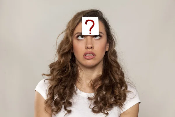 Question mark on her forehead — Stock Photo, Image