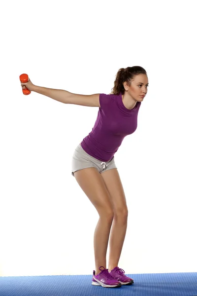 Chica haciendo ejercicio con peso — Foto de Stock