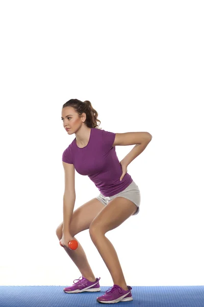 Girl exercising with weight — Stock Photo, Image