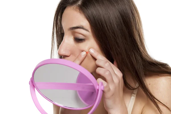 Woman squeezing  a pimple — Stock Photo, Image