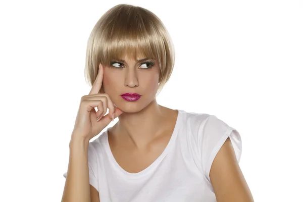 Woman with a blonde wig — Stock Photo, Image