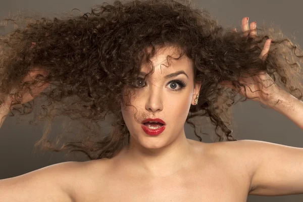 Shocked girl holding her hair — Stock Photo, Image