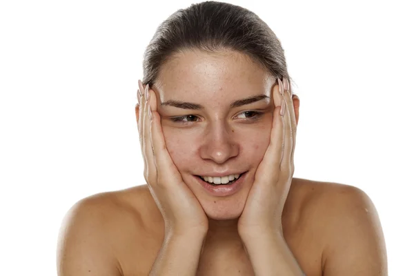 Mujer frotándose la cara — Foto de Stock