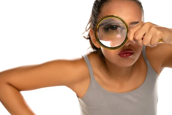 Suspicious Young Woman Looks Magnifying Glass White Background — Stock Photo, Image