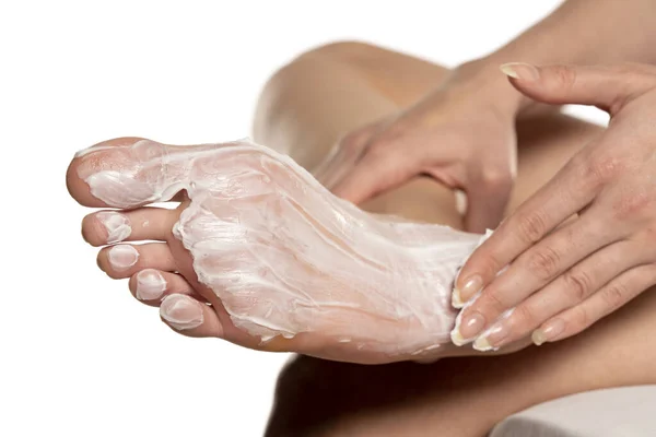 Woman Applying Foot Mask Her Sole Feet White Background — Stock Photo, Image