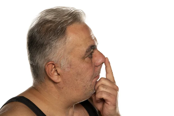 Middle Aged Man Touches His Nose White Background — Stock Photo, Image