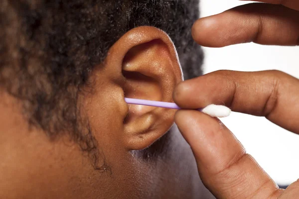 Cotton swab into the ear — Stock Photo, Image