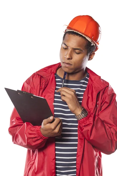 Trabajador con casco y bloc de notas — Foto de Stock