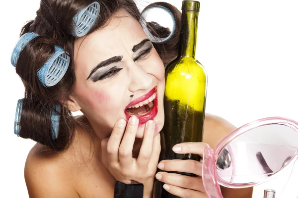 Drunk woman with curlers — Stock Photo, Image