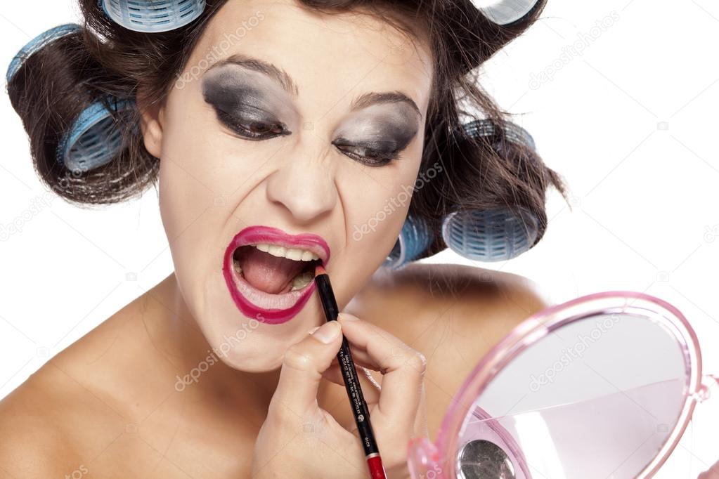 Hair curlers and bad make up Stock Photo by 70680335