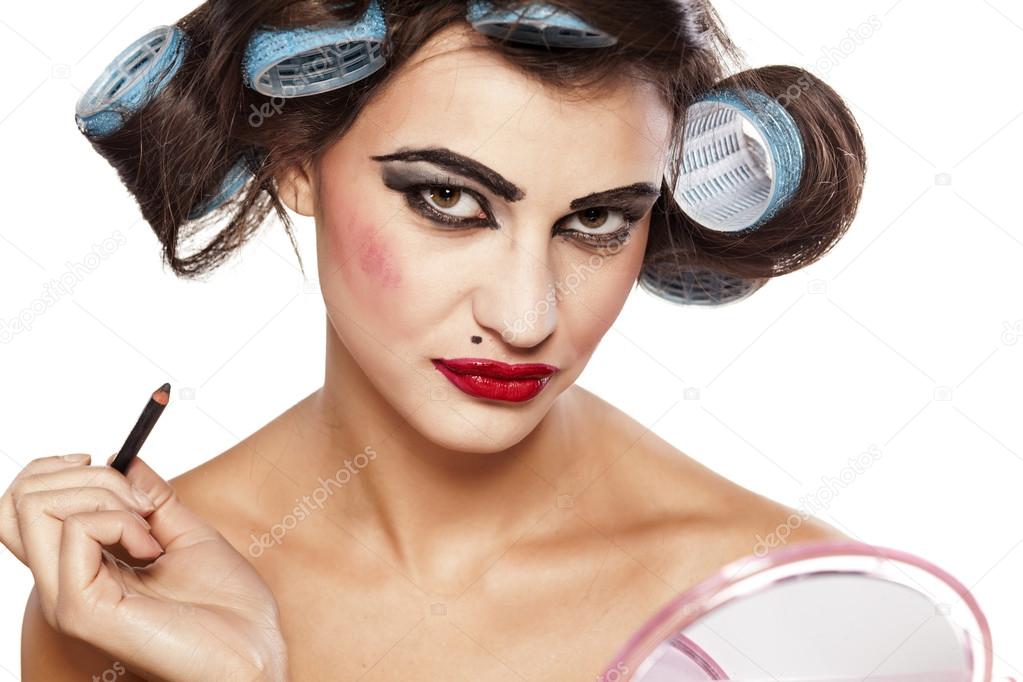 Hair curlers and bad make up Stock Photo by 70680595