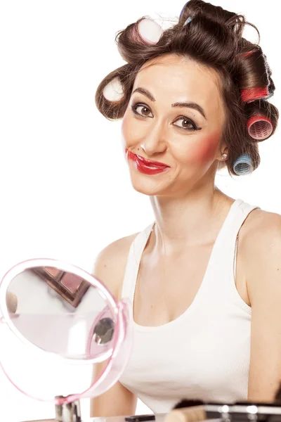 Woman with curlers and smeared makeup — Stock Photo, Image