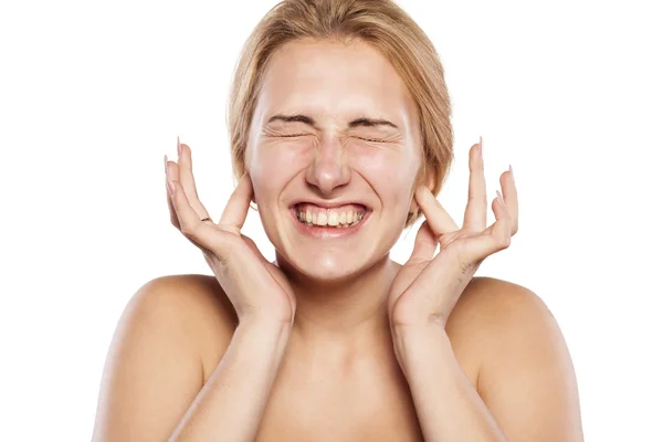 Blonde closing her ears — Stock Photo, Image