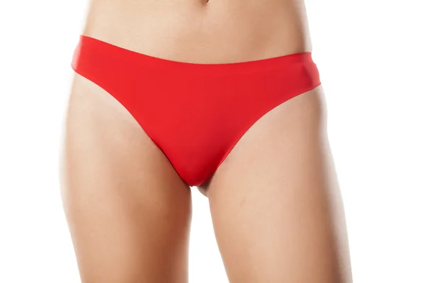 Woman's hips in red panties — Stock Photo, Image