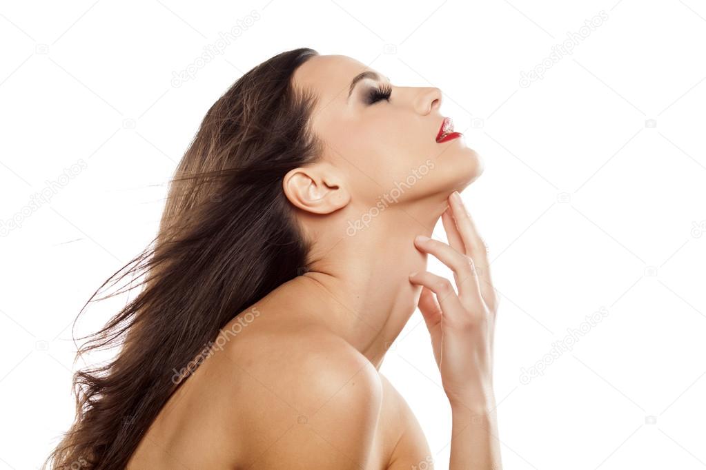 Woman touching her neck