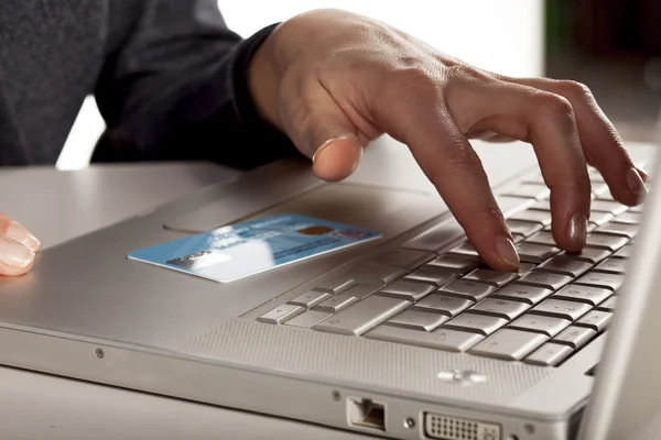 Credit card on laptop — Stock Photo, Image