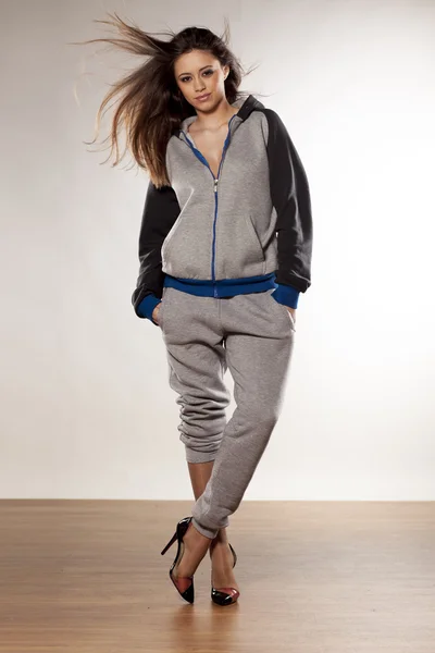 Track suit and high heels — Stock Photo, Image