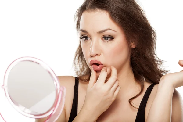 Woman touching her lips — Stock Photo, Image