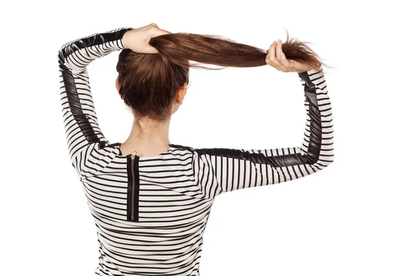 Mujer sosteniendo su cabello —  Fotos de Stock