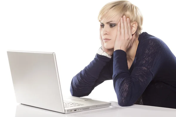 Blond with a laptop — Stok fotoğraf