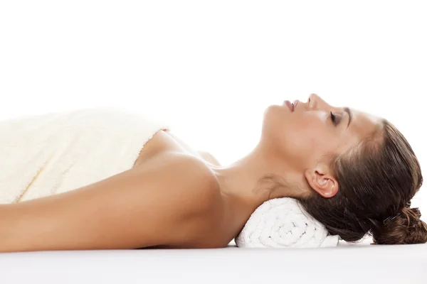 Woman lying on a massage table — Stock Photo, Image