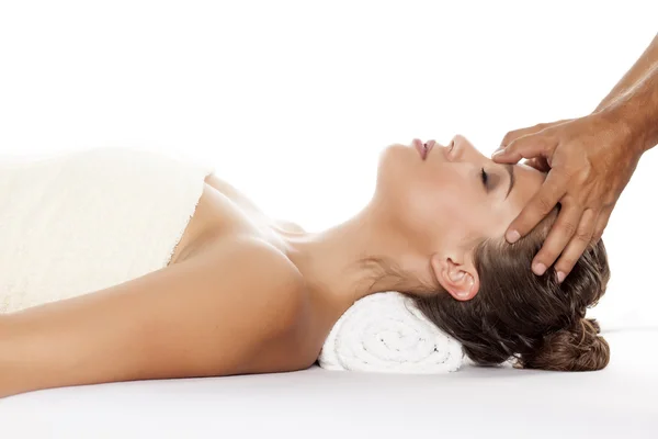 Woman enjoying forehead massage — Stock Photo, Image