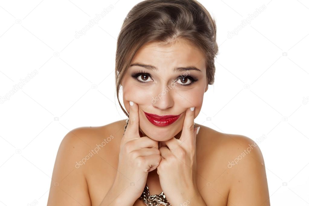 woman making a false smile