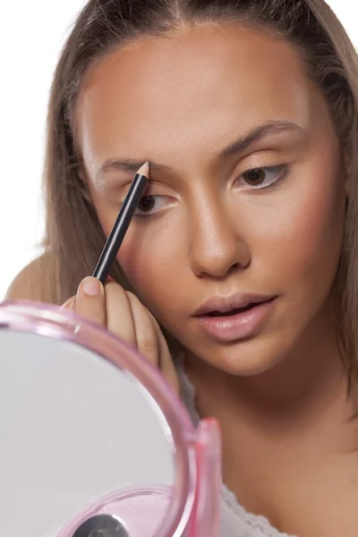 Girl shaping eyebrows — Stock Photo, Image