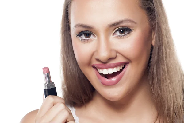 Girl holding a lipstick — Stock Photo, Image