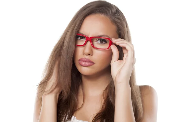 Serious beautiful girl with glasses — Stock Photo, Image