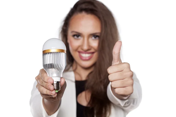 Thumb up for energy savings — Stock Photo, Image
