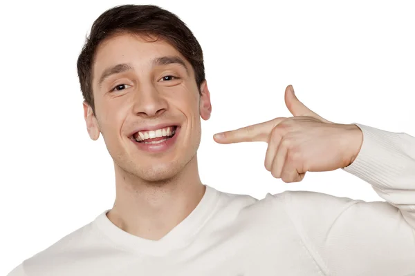 Pointing at his teeth — Stock Photo, Image