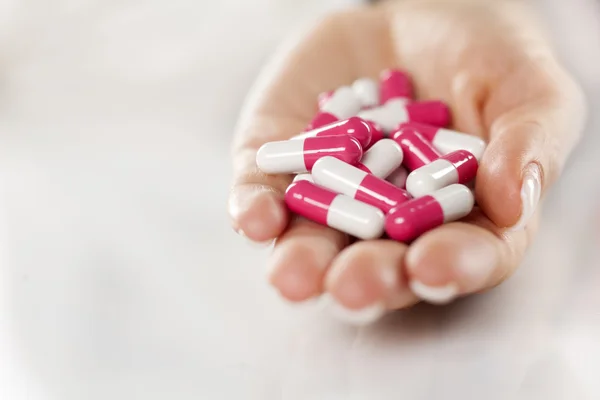 Capsule pills in a hand — Stock Photo, Image