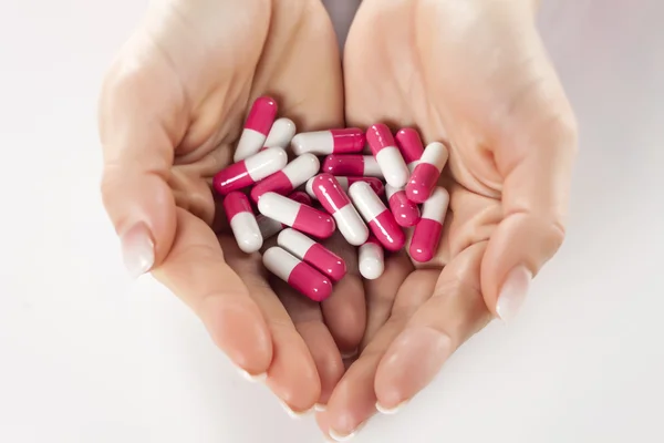 Capsule pills in hands — Stock Photo, Image