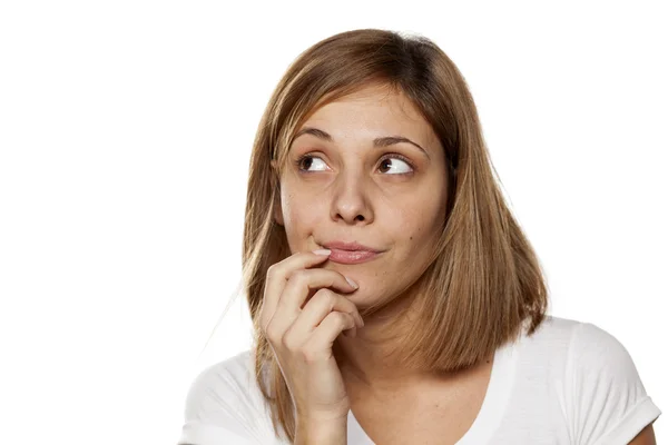 Thoughtful young woman Royalty Free Stock Photos