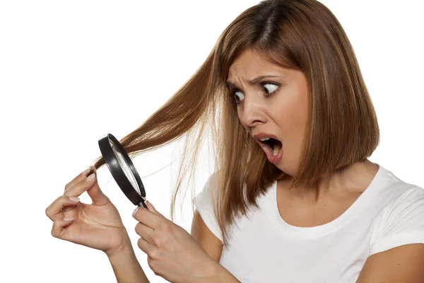 Unhappy with her hair — Stock Photo, Image