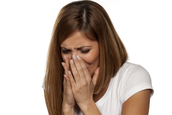 beautiful woman sneezing