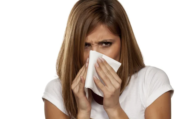 Beautiful woman sneezing — Stock Photo, Image