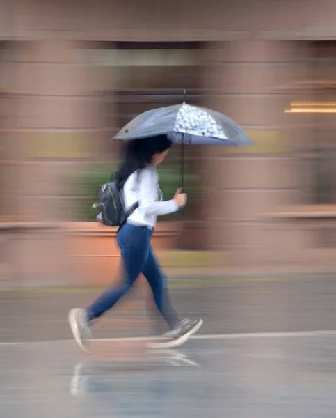 Woman Umbrella Walking Street Rainy Day Intentional Motion Blur Defocused — Stock Photo, Image