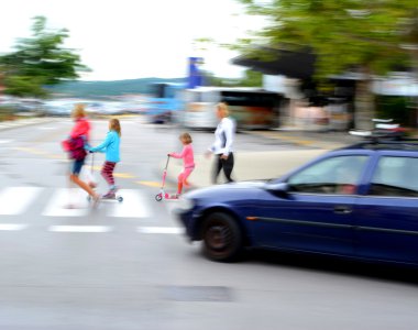 Dangerous city traffic situation with children and car clipart