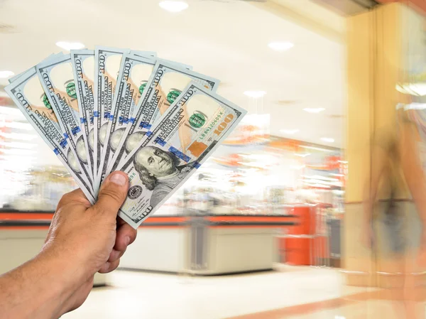 Man holding stack of dollar bills — Stock Photo, Image