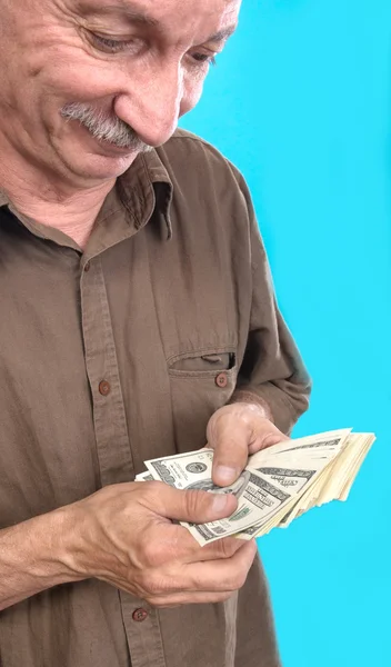 Lucky elderly man holding dollar bills — Stock Photo, Image