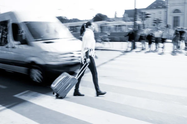 Dangerous city traffic situation with a woman and a bus — Stock Photo, Image