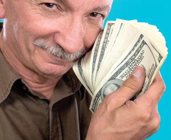 Homem idoso sortudo segurando notas de dólar — Fotografia de Stock
