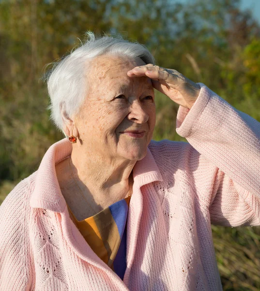 Portrait of old smiling woman — Stock Photo, Image