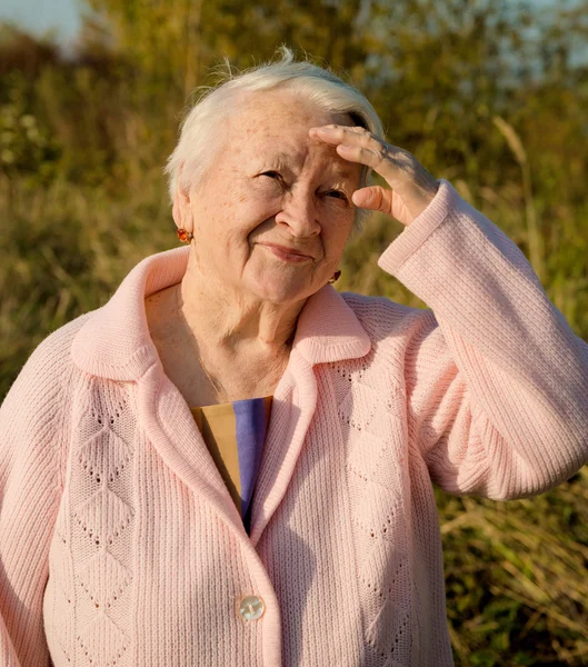 Portrait of old smiling woman — Stock Photo, Image