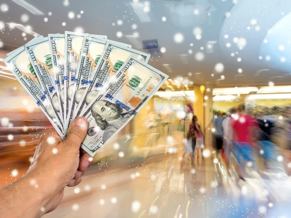 Man holding stack of dollar bills — Stock Photo, Image