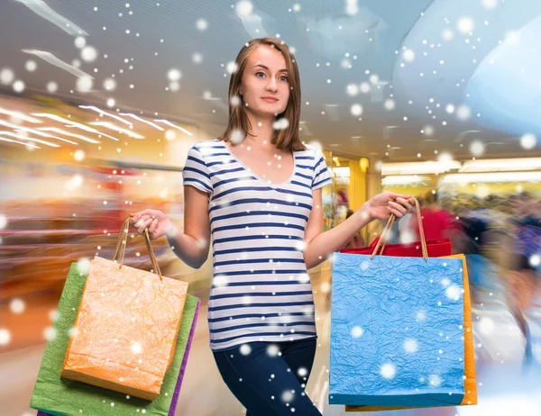 Young happy girl with shopping bags — Stock Photo, Image