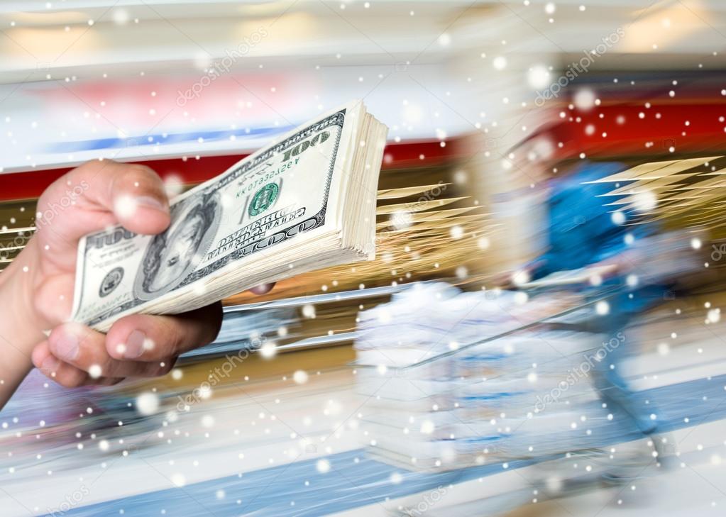 Man holding stack of dollar bills