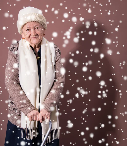 Old woman with a cane — Stock Photo, Image